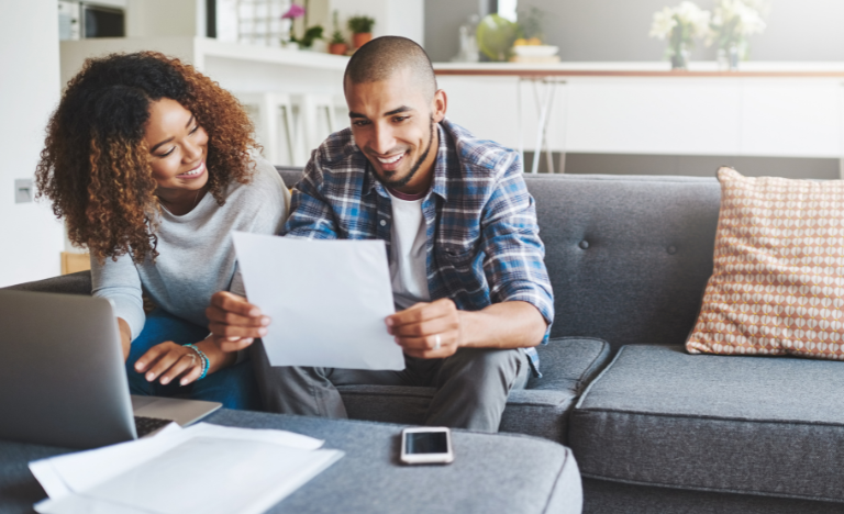 Female and Male reviewing tax documents